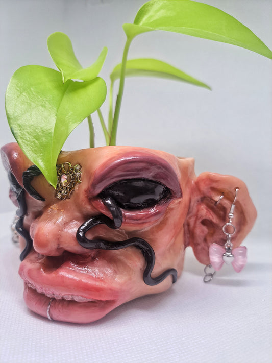 Creepy handmade face flowerpot