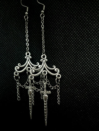 Earrings with chains and dagger pendant